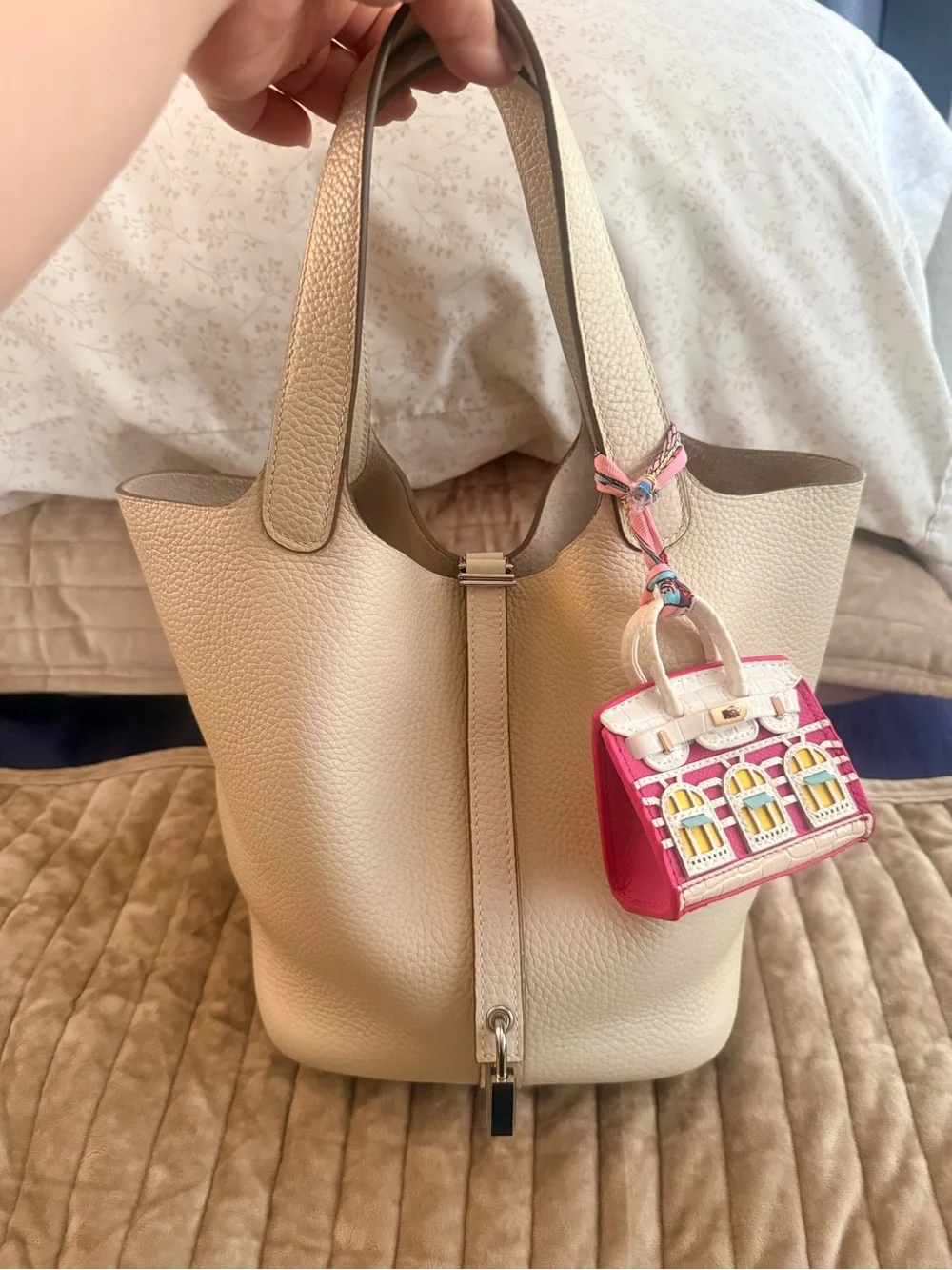 Leather bucket bag with charm